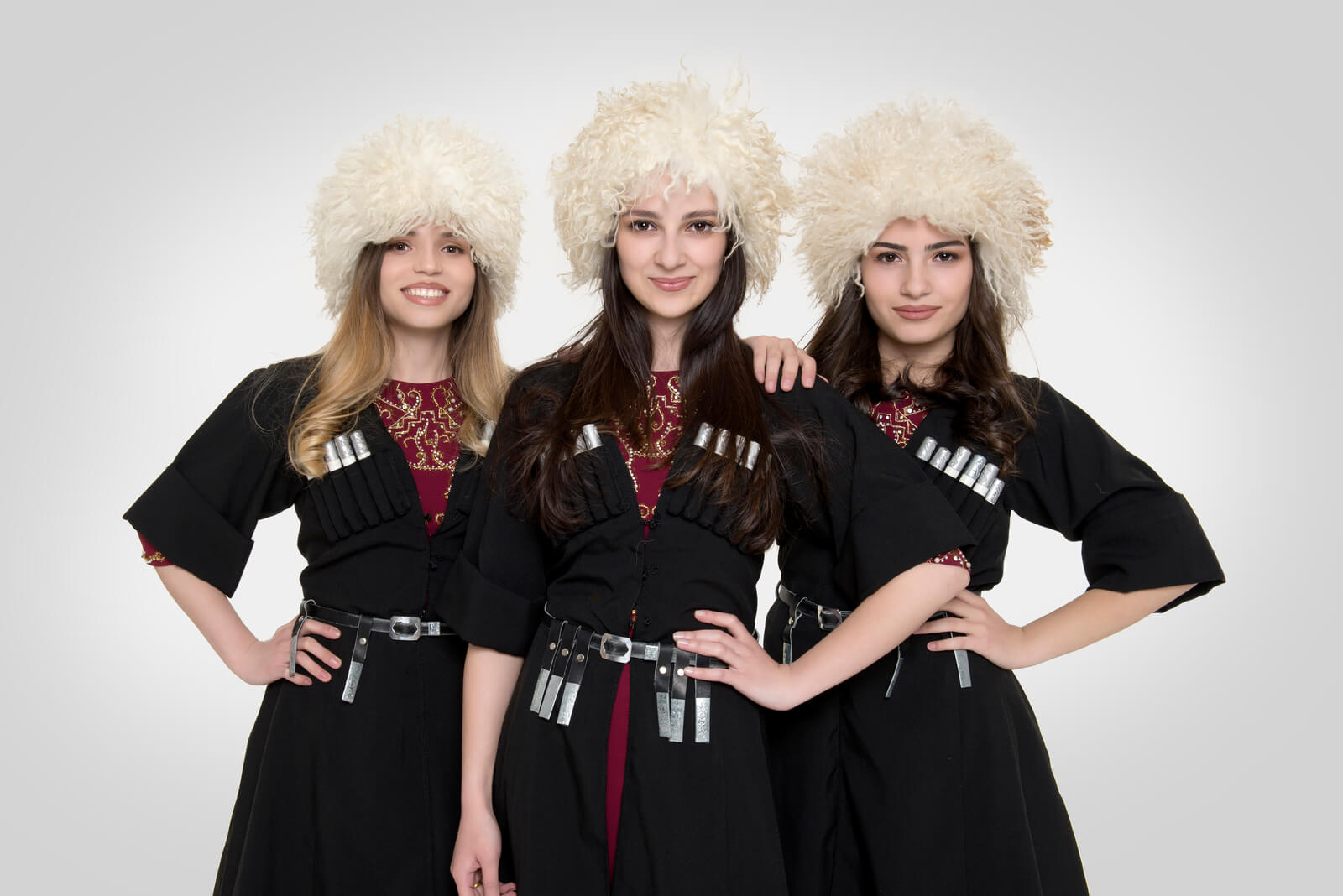 Trio Mandili, the Georgian folk trio, in traditional dress and papakhi hats